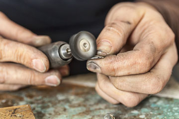 polishing silver with a buffing wheel